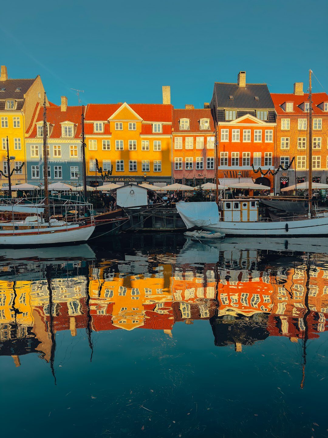 Fishing boats docked in a Danish harbour at dawn